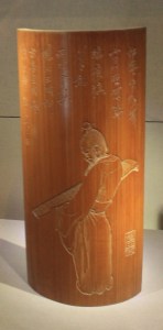 Wrist-rest carved with A lady carrying zheng