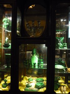 Display cabinet of green objects